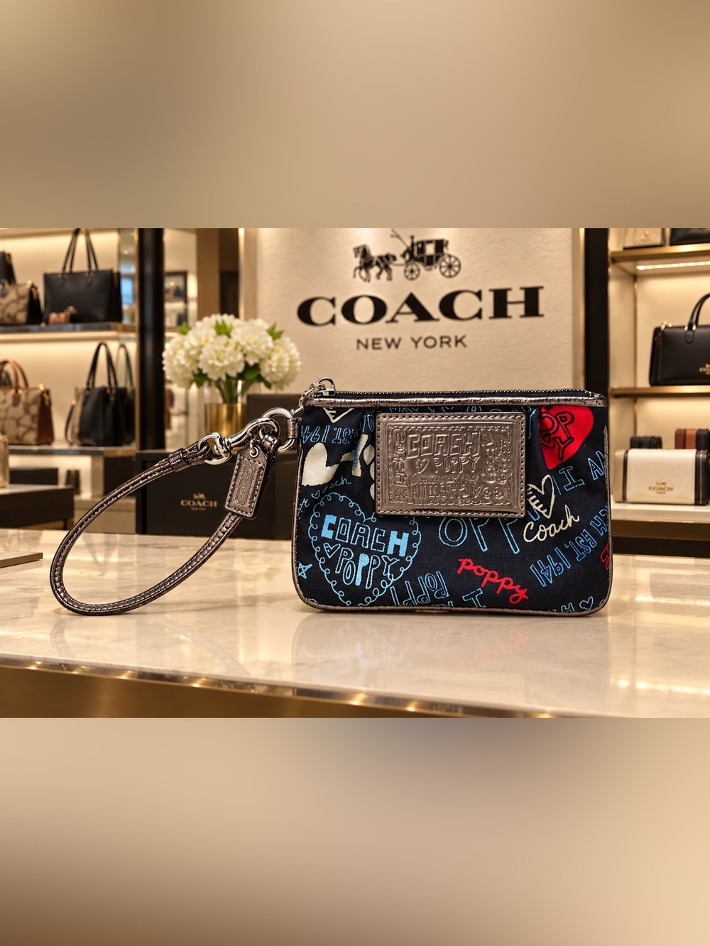 Coach Black Celia Poppy Graphic Wristlet with Metallic Trim